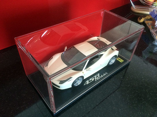 Glass display cabinet with car