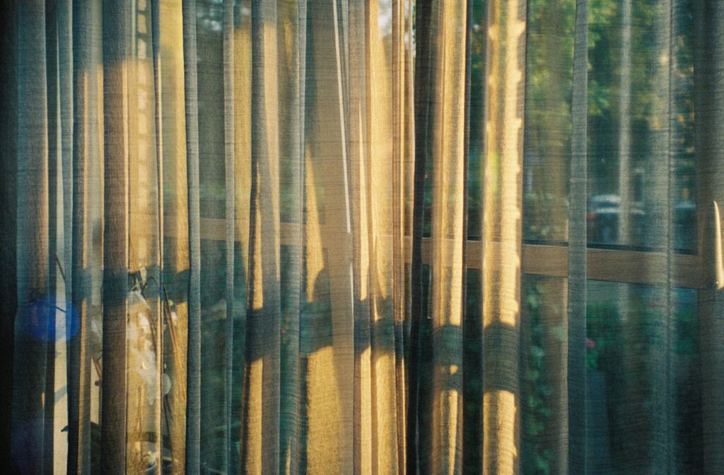 sheer curtain filtering sunlight from window