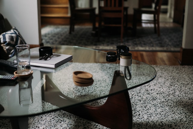 modern glass table in a living room filled with natural light