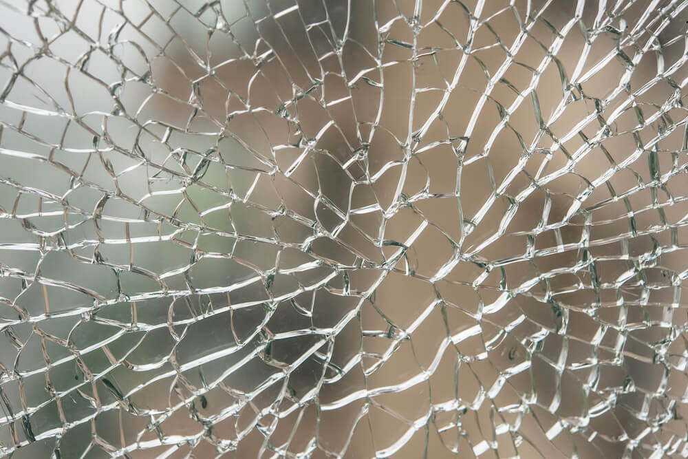 Close up of spontaneously broken pane of glass